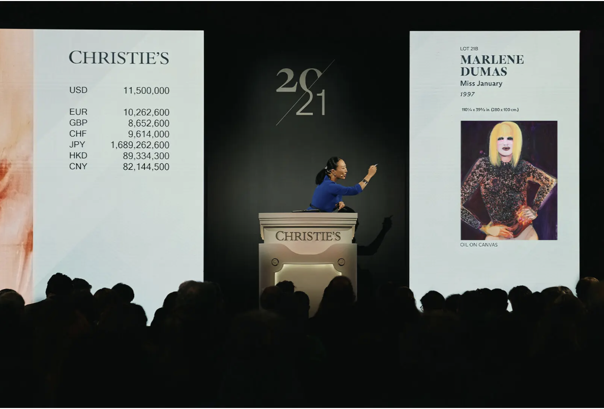 Image of an auctioneer selling a painting at auction